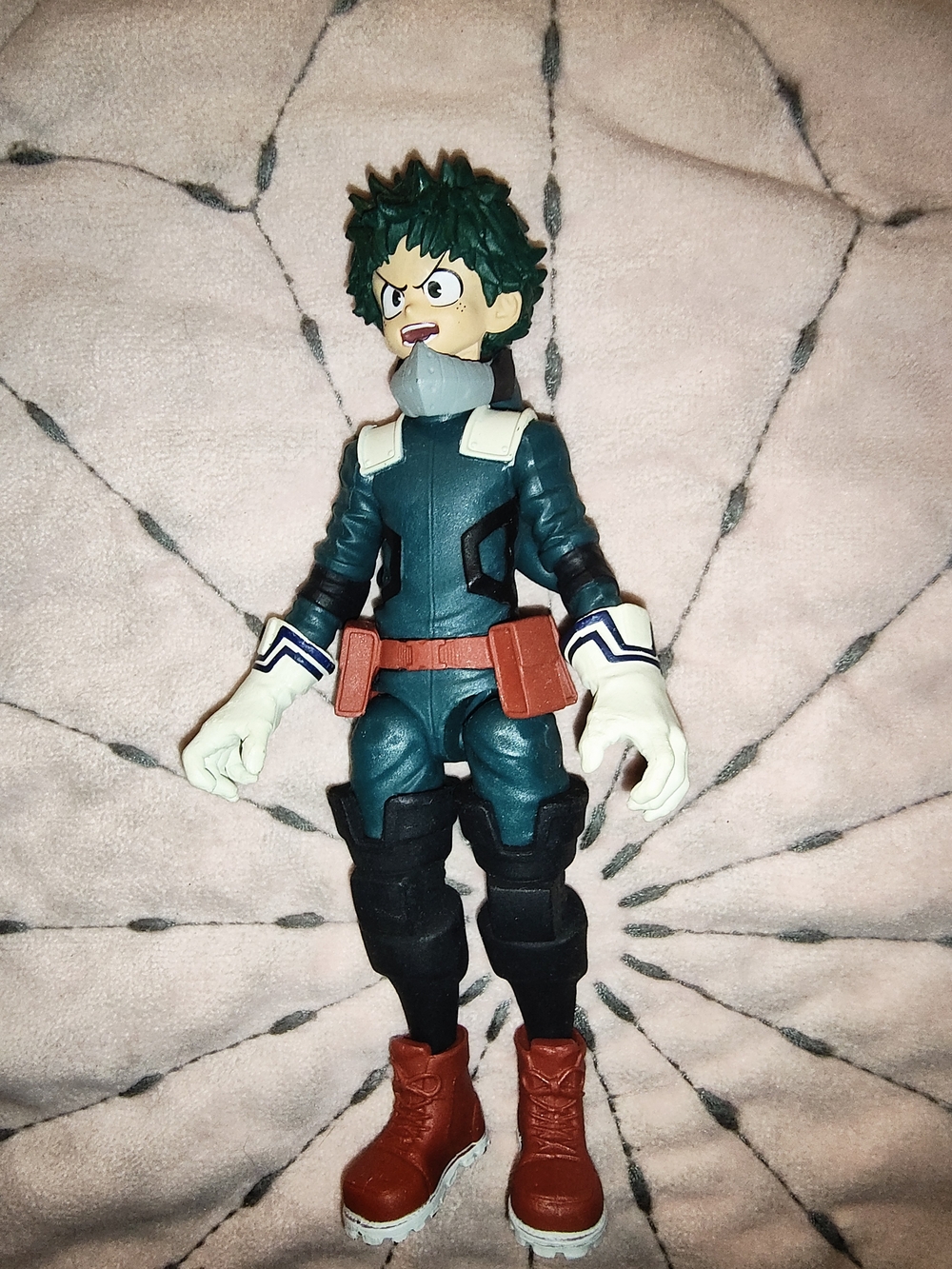 Green and Red Superhero Action Figure with White Gloves